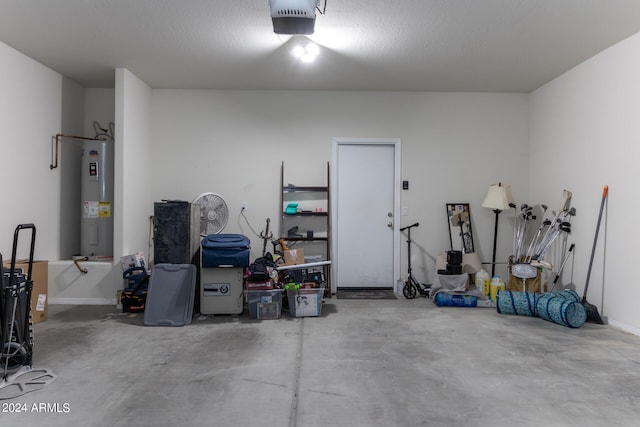 garage featuring electric water heater and a garage door opener