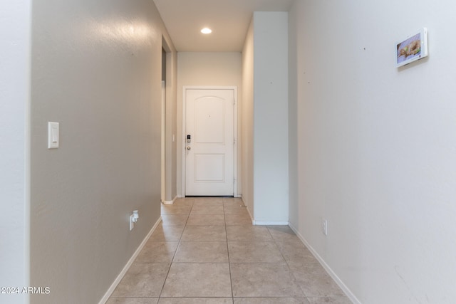 corridor with light tile patterned floors