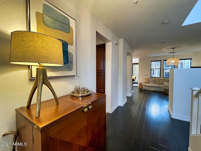 18507 N 94th St, Scottsdale, AZ 85255 - hall with baseboards, dark wood-style flooring, and a skylight