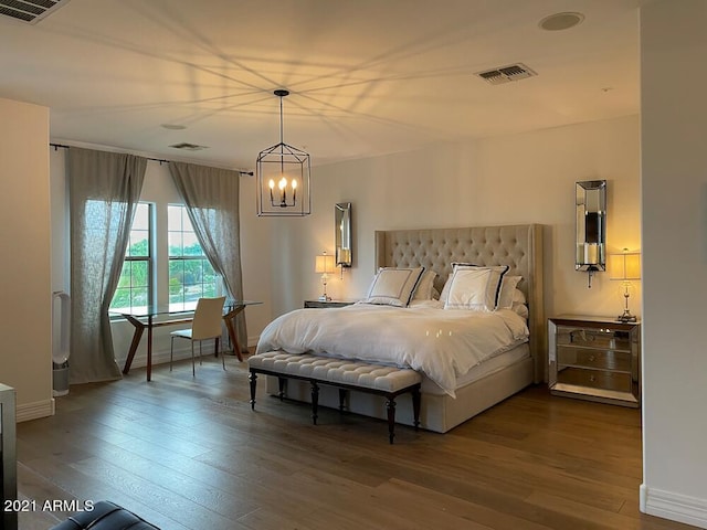 18507 N 94th St, Scottsdale, AZ 85255 - bedroom with a chandelier, visible vents, and wood finished floors