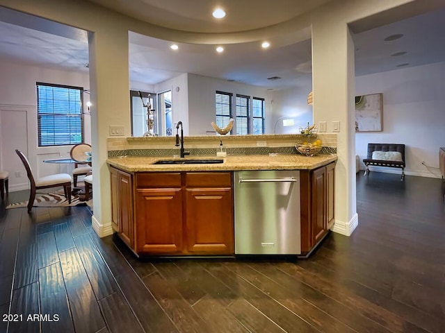 18507 N 94th St, Scottsdale, AZ 85255 - kitchen with dishwasher, brown cabinets, light stone countertops, and a sink