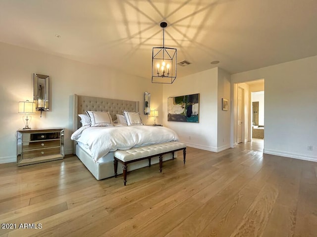 18507 N 94th St, Scottsdale, AZ 85255 - bedroom featuring a chandelier, baseboards, visible vents, and wood finished floors