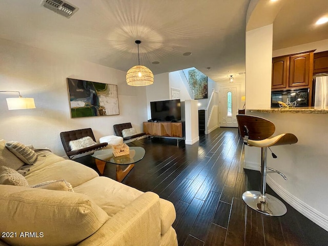18507 N 94th St, Scottsdale, AZ 85255 - living area featuring dark wood finished floors, visible vents, baseboards, and a skylight
