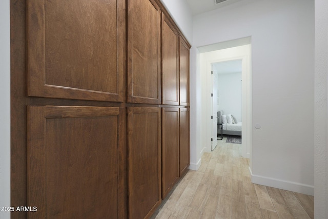 20834 W Prospector Way, Buckeye, AZ 85396 - hallway with light wood-style flooring and baseboards