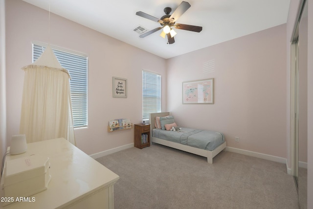 20834 W Prospector Way, Buckeye, AZ 85396 - bedroom with light carpet, baseboards, and ceiling fan