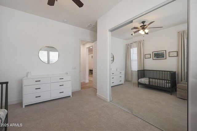 20834 W Prospector Way, Buckeye, AZ 85396 - unfurnished bedroom featuring light colored carpet, a closet, and a ceiling fan