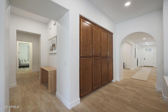 20834 W Prospector Way, Buckeye, AZ 85396 - hallway featuring arched walkways, light wood-style flooring, baseboards, and recessed lighting