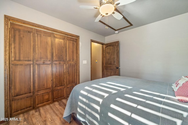 bedroom with ceiling fan and wood finished floors