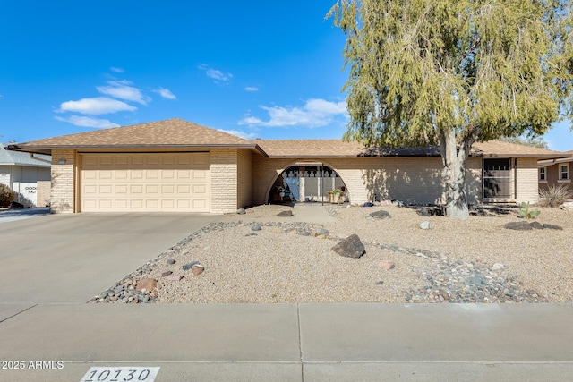 ranch-style home featuring a garage