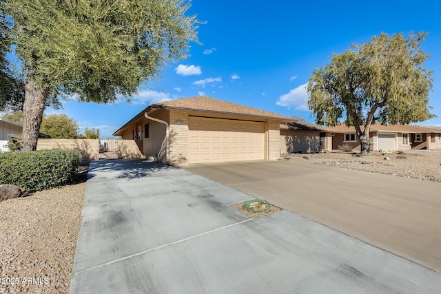 single story home with a garage