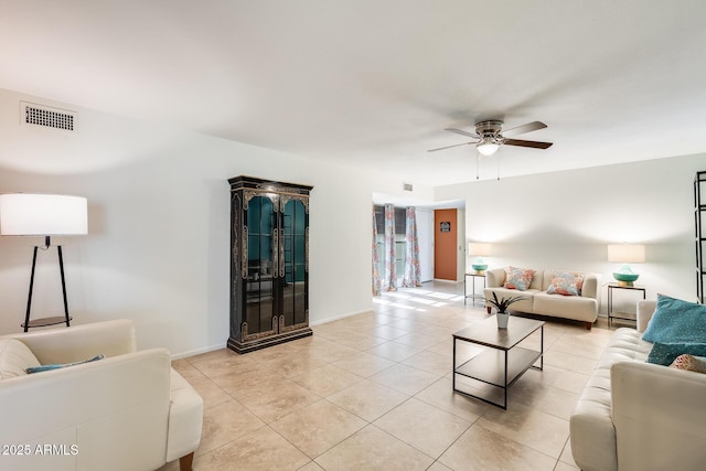 living room featuring ceiling fan and light tile patterned flooring