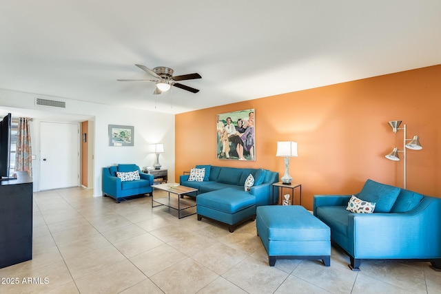 living room featuring ceiling fan and light tile patterned floors