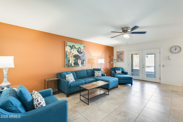 tiled living room featuring ceiling fan and french doors