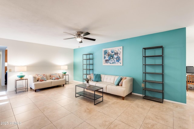 living room with ceiling fan and light tile patterned floors