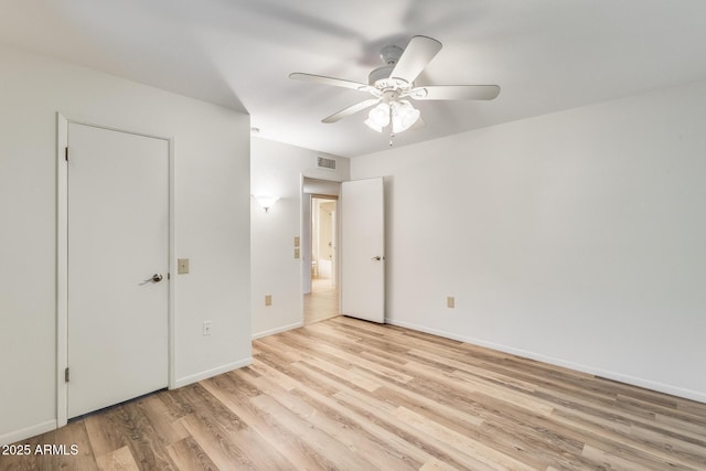 unfurnished bedroom with ceiling fan and light hardwood / wood-style flooring