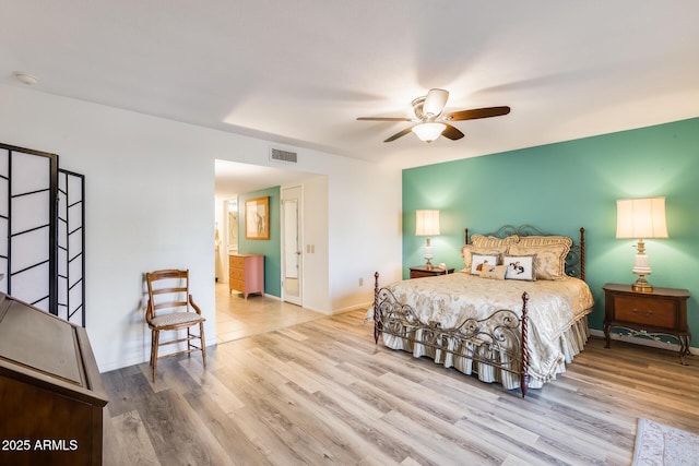 bedroom with ceiling fan and hardwood / wood-style flooring