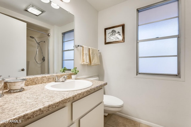 bathroom with walk in shower, tile patterned flooring, plenty of natural light, and toilet