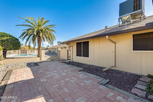 view of patio / terrace featuring a fenced in pool and central AC