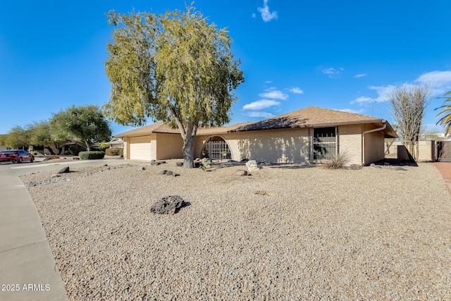 single story home with a garage