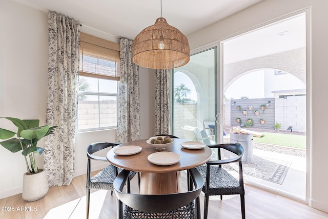 645 N Vine St, Chandler, AZ 85225 - dining room with wood finished floors, baseboards, and a chandelier