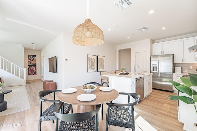 645 N Vine St, Chandler, AZ 85225 - dining room with light wood-type flooring, stairs, and recessed lighting