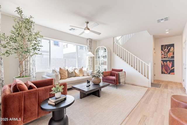 645 N Vine St, Chandler, AZ 85225 - living room featuring wood finished floors, a ceiling fan, stairs, and baseboards