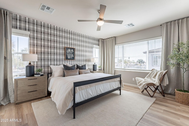 645 N Vine St, Chandler, AZ 85225 - bedroom featuring wallpapered walls, baseboards, light wood-style flooring, and ceiling fan