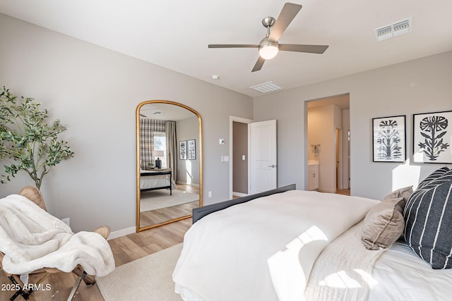 645 N Vine St, Chandler, AZ 85225 - bedroom featuring light wood-style floors, baseboards, a ceiling fan, and ensuite bathroom