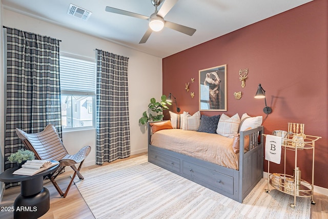 645 N Vine St, Chandler, AZ 85225 - bedroom with wood finished floors, baseboards, and ceiling fan