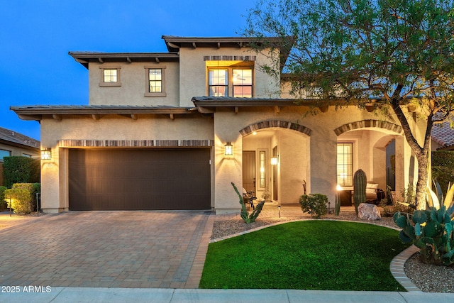 1829 N Atwood, Mesa, AZ 85207 - view of front facade featuring a garage, stucco siding, and decorative driveway