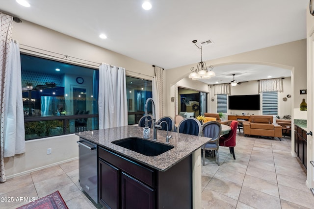 1829 N Atwood, Mesa, AZ 85207 - kitchen with light tile patterned floors, arched walkways, a sink, a ceiling fan, and stone countertops