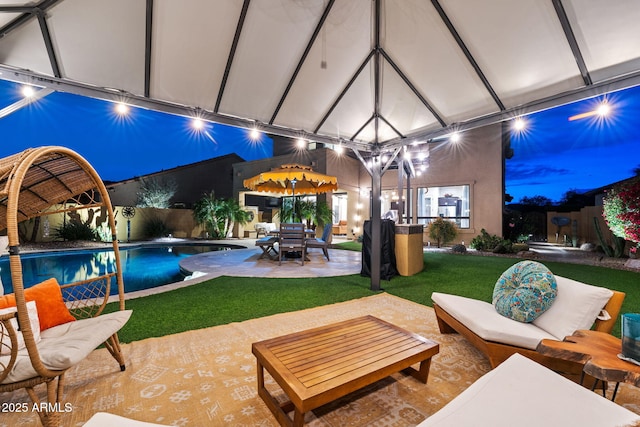 1829 N Atwood, Mesa, AZ 85207 - patio at twilight featuring a fenced in pool, an outdoor living space, and a lawn