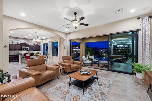 1829 N Atwood, Mesa, AZ 85207 - living area featuring recessed lighting, arched walkways, visible vents, and ceiling fan with notable chandelier