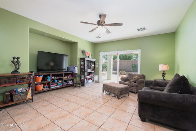 living room with ceiling fan and light tile flooring