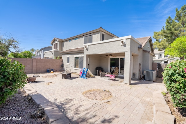 rear view of property featuring a patio area and central air condition unit