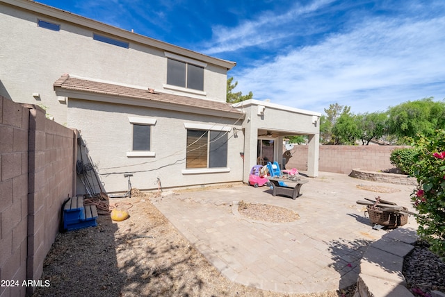 back of house featuring a patio