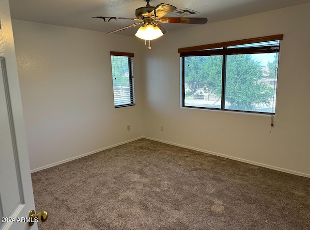 unfurnished room with carpet and ceiling fan