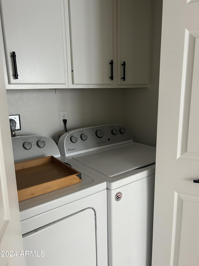 laundry area with cabinets and independent washer and dryer