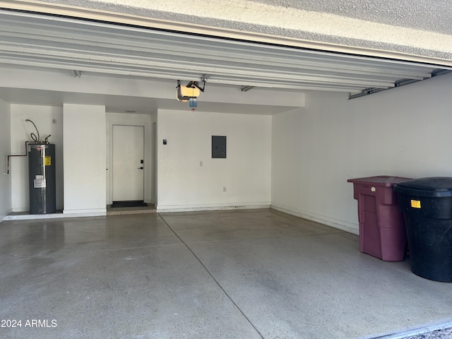 garage featuring electric water heater, electric panel, and a garage door opener