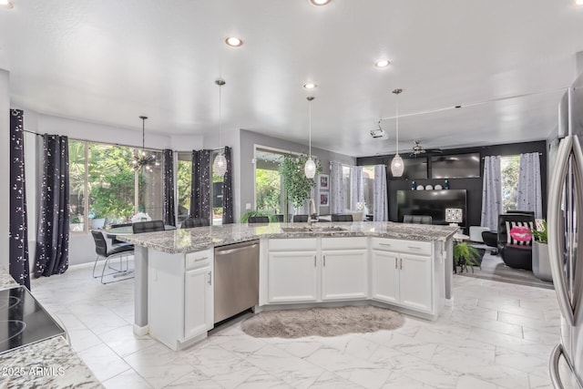 kitchen featuring marble finish floor, a sink, and appliances with stainless steel finishes