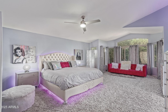 bedroom featuring a ceiling fan, carpet flooring, and vaulted ceiling