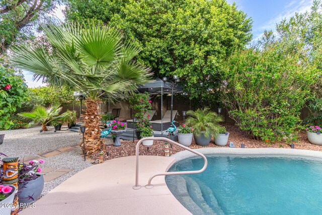 outdoor pool with a patio