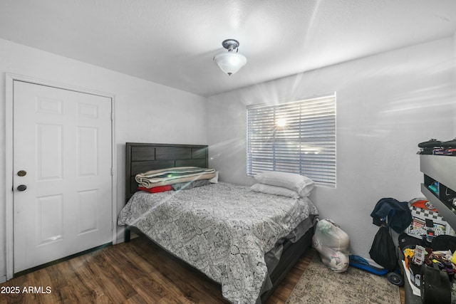 bedroom featuring dark wood-type flooring