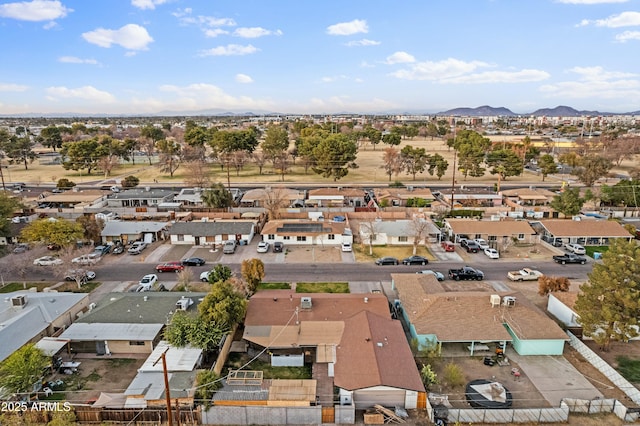 birds eye view of property with a mountain view