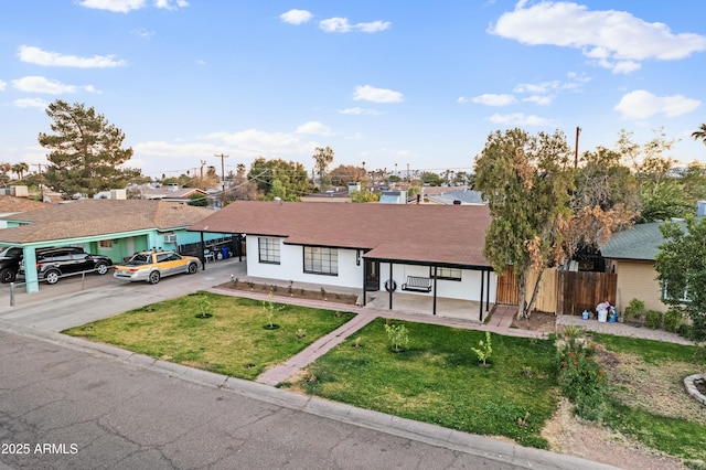 ranch-style house featuring a front lawn