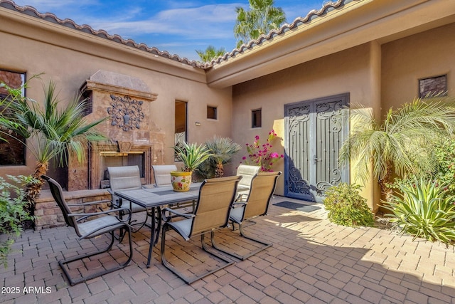 4301 E Taurus Pl, Chandler, AZ 85249 - view of patio / terrace with an outdoor stone fireplace and outdoor dining area