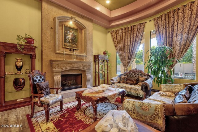 living area with a fireplace and wood finished floors