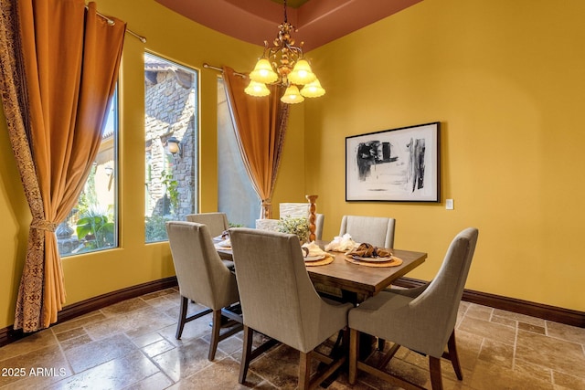 4301 E Taurus Pl, Chandler, AZ 85249 - dining space with stone tile flooring, a chandelier, and plenty of natural light