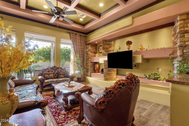 living room featuring visible vents, coffered ceiling, ceiling fan, wood finished floors, and beamed ceiling