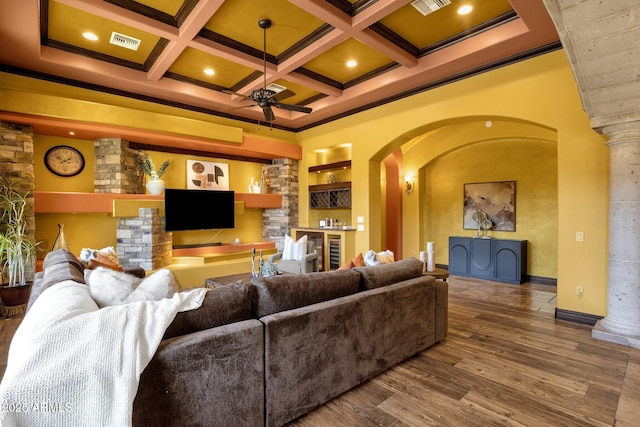 4301 E Taurus Pl, Chandler, AZ 85249 - living area featuring a ceiling fan, arched walkways, ornate columns, ornamental molding, and beam ceiling